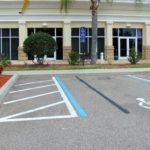 Florida Hotel parking Lot does not have a clear accessible path to the entry. ADA Fail.